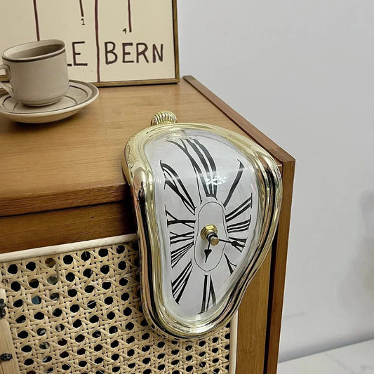 a Dali clock hanging above a desk